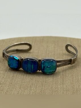 silver cuff bracelet with three blue-green dichroic glass or triplet opal stones